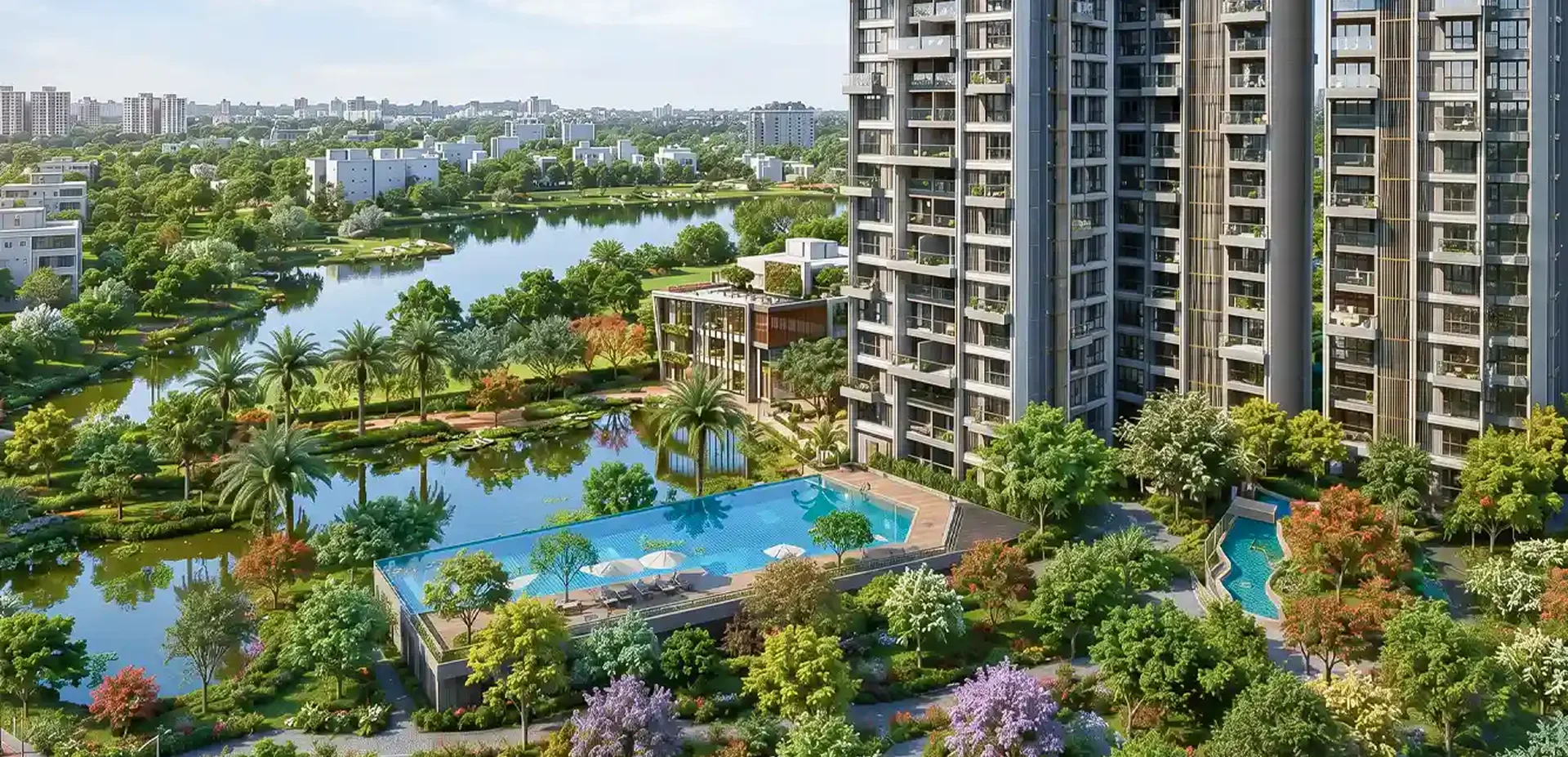 BLUE New Alipore Kolkata — towers beside a lake with landscaped pool deck
